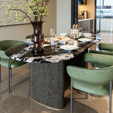 Modern oval black marble dining table with double pedestal base for stylish dining rooms